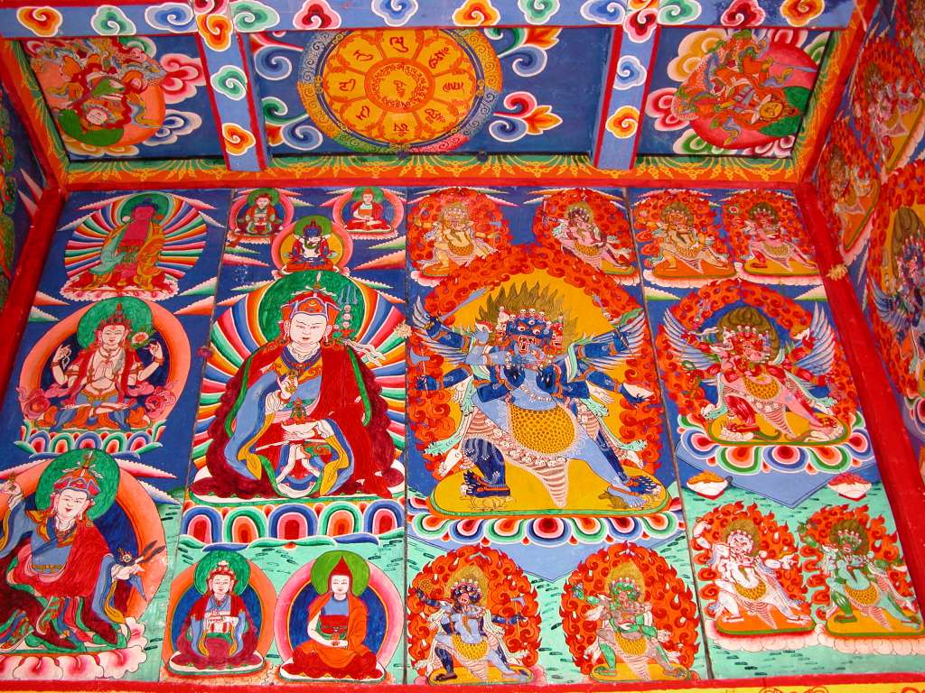 Manaslu 06 08 Syala Kani Painting The paintings on Syalas kani wall include a 4-armed Avalokiteshvara on the left, then Padmasambhava, a six-armed Mahakala, and red Hayagriva on the right.